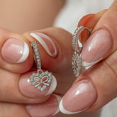 Boucles d'oreilles pendantes en forme de cœur et de ruban argenté pour femme